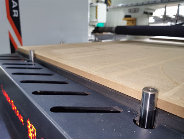 What are the functions of installing a positioning cylinder on a wooden CNC router?